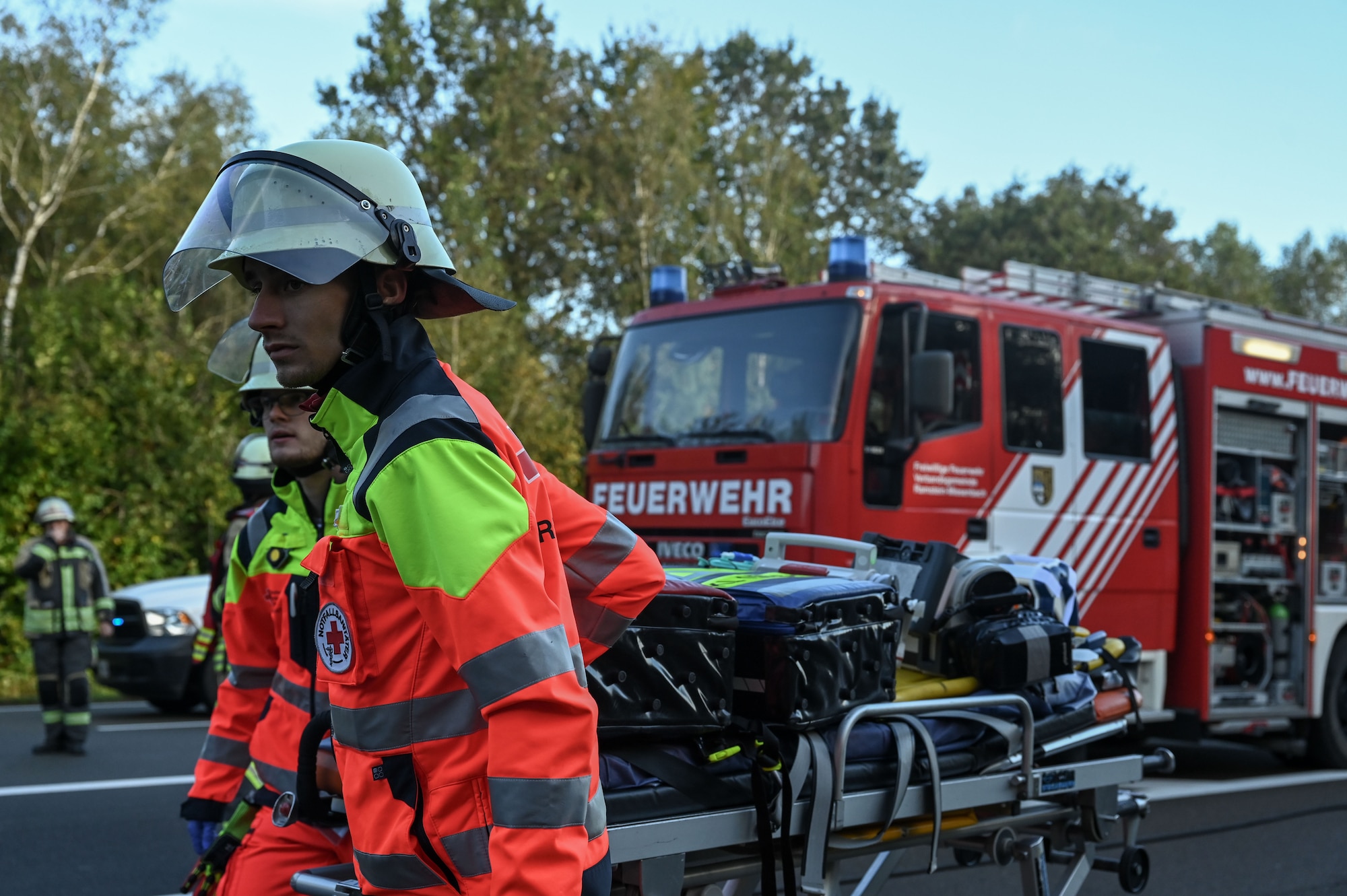 German first responders bring a stretcher to a simulated exercise