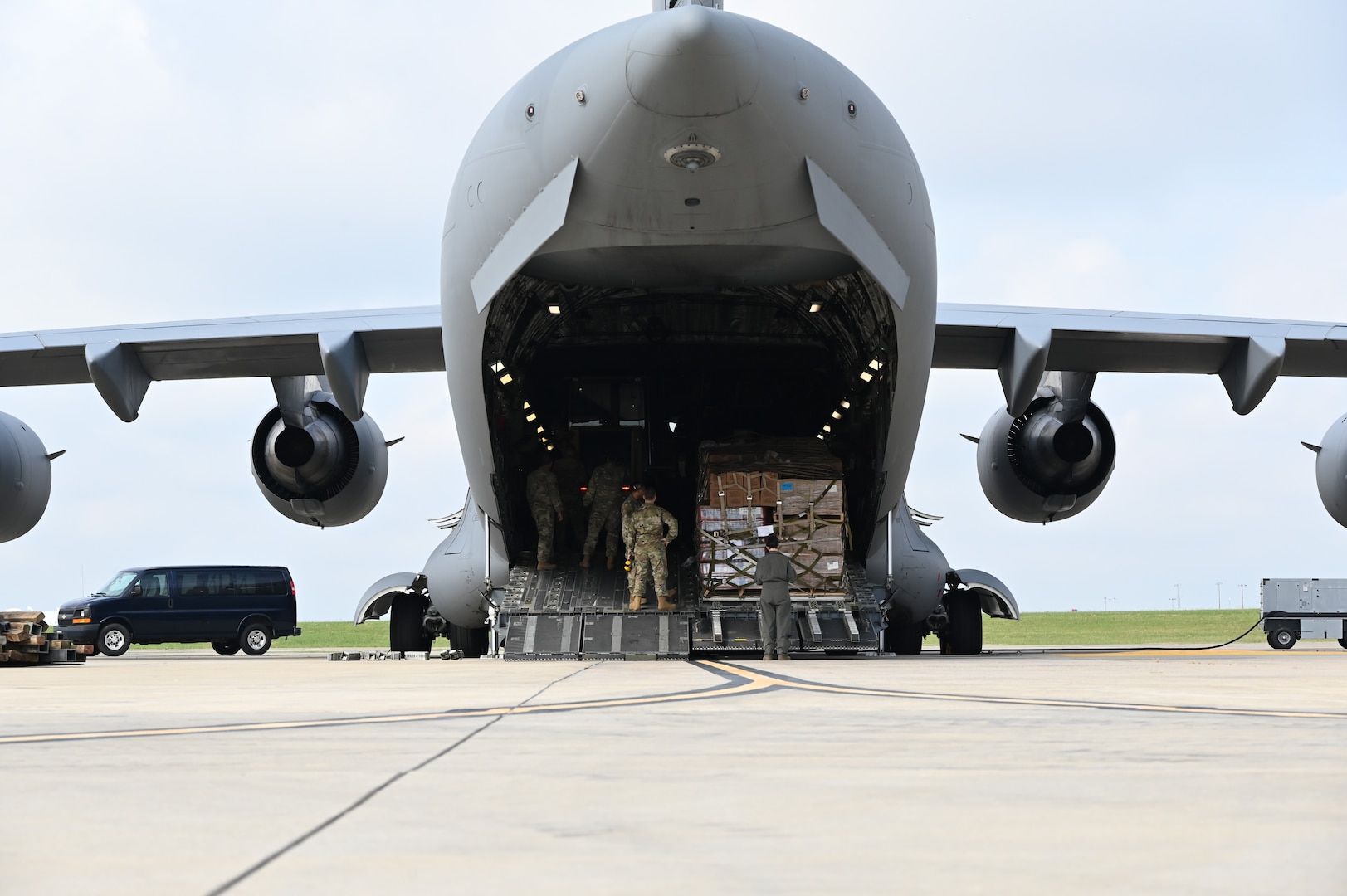 Members of the North Carolina Air National Guard transport more than 100,000 pounds of essential goods to Western North Carolina in support of humanitarian efforts following Hurricane Helene. The cargo, delivered aboard a C-17 Globemaster III, consisted of more than 48 pallets of water, Meals Ready to Eat and other vital supplies.