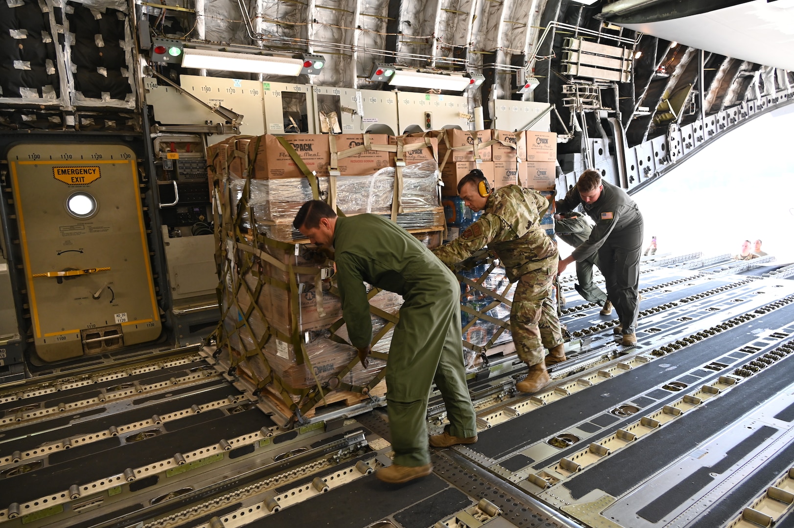 Members of the North Carolina Air National Guard transport more than 100,000 pounds of essential goods to Western North Carolina in support of humanitarian efforts following Hurricane Helene. The cargo, delivered aboard a C-17 Globemaster III, included more than 48 pallets of water, Meals Ready to Eat and other vital supplies.