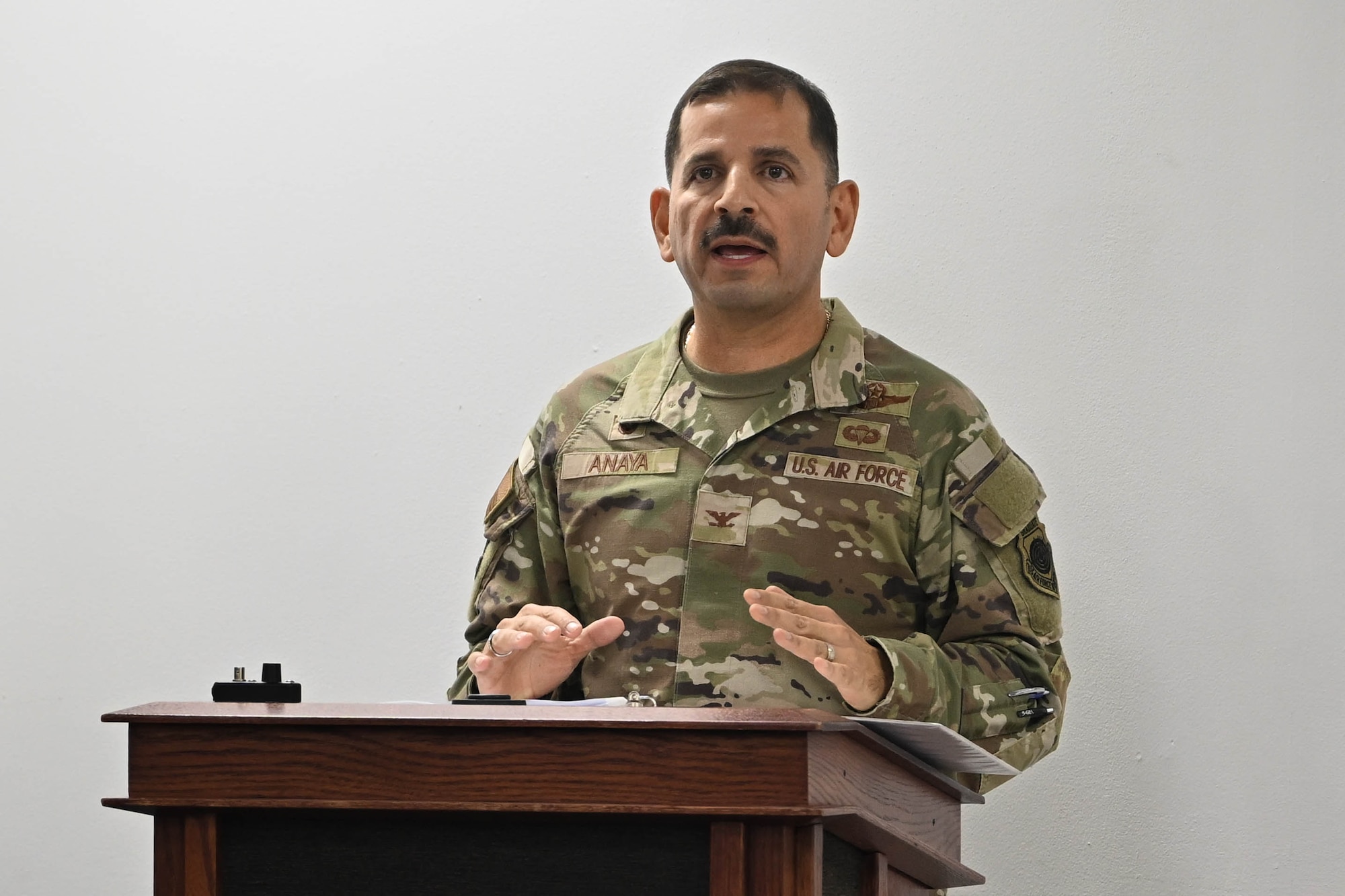 A man gives a speech during a ceremony.