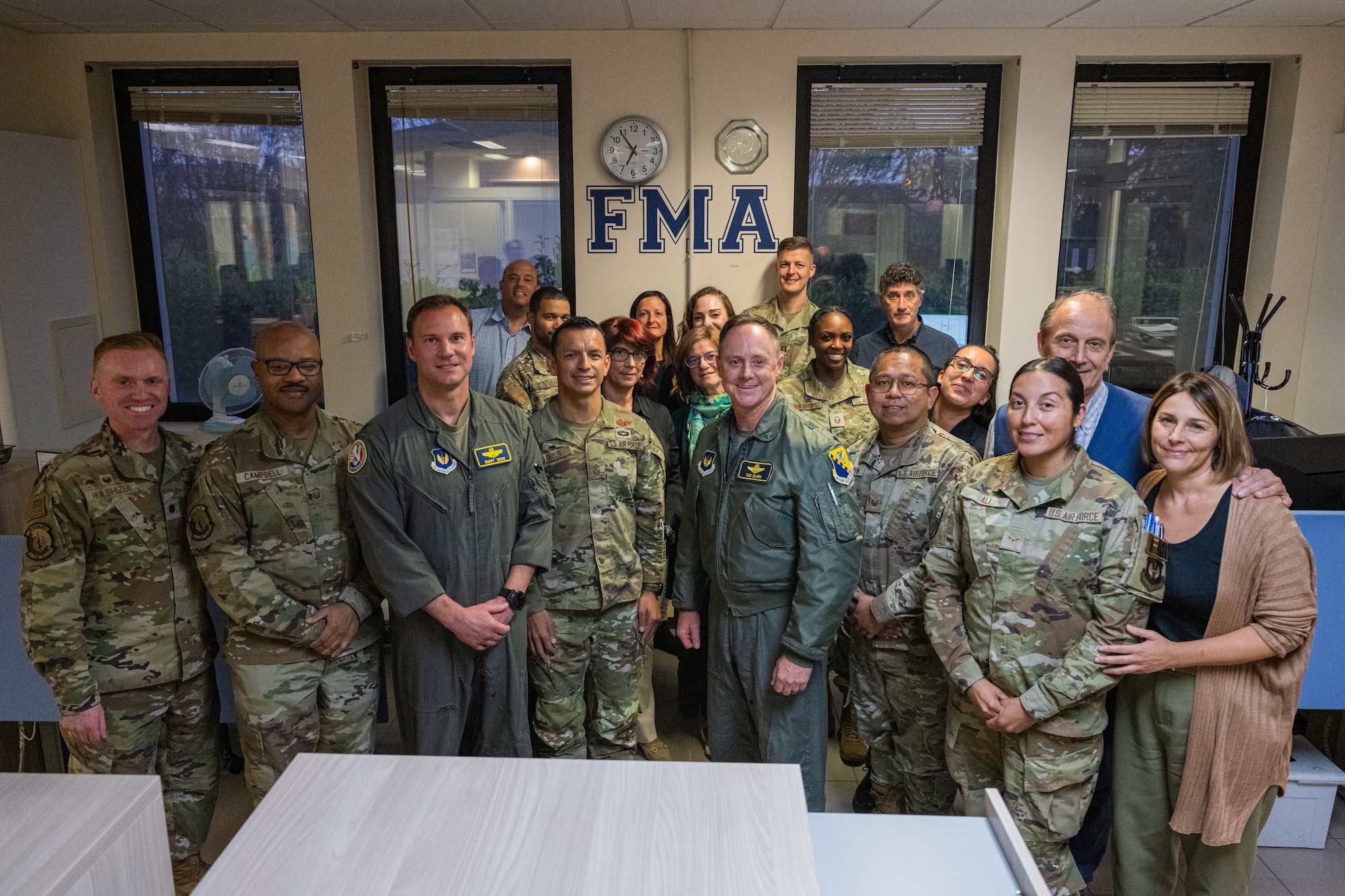 The 31st Fighter Wing command team and the 31st Comptroller Squadron’s financial analyst flight pose for a group photo.