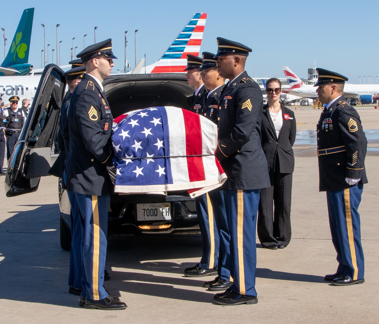 A military and funeral honors team loads the flag-draped coffin containing the remains of Illinois Army National Guard Pfc. Harry Jerele into a hearse at O'Hare International Airport in Chicago Oct. 1, 2024. Jerele was a World War II prisoner of war who died in captivity in 1943.