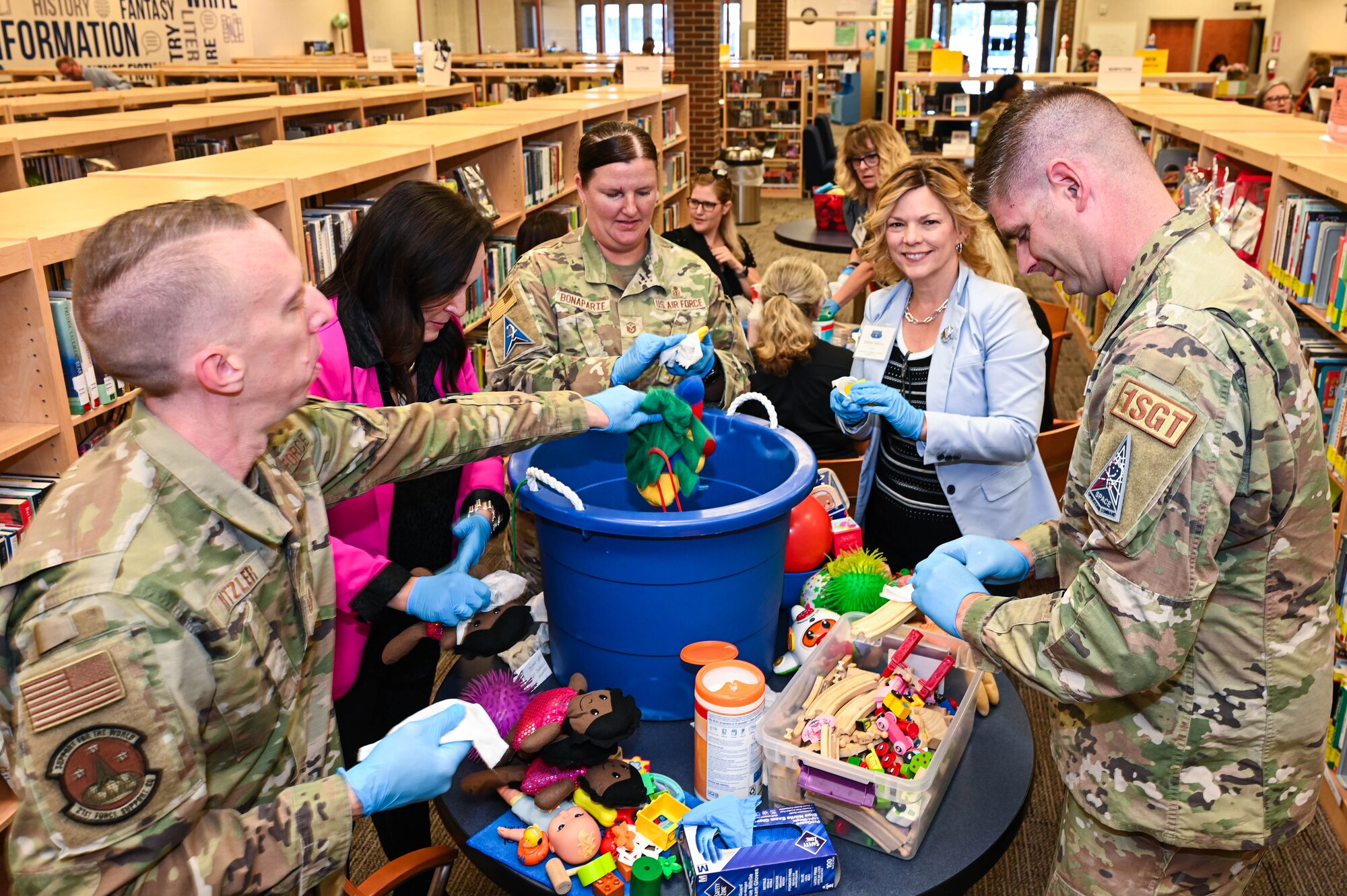 Service members collaborate with military spouses