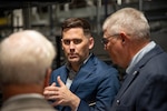 three men in a warehouse