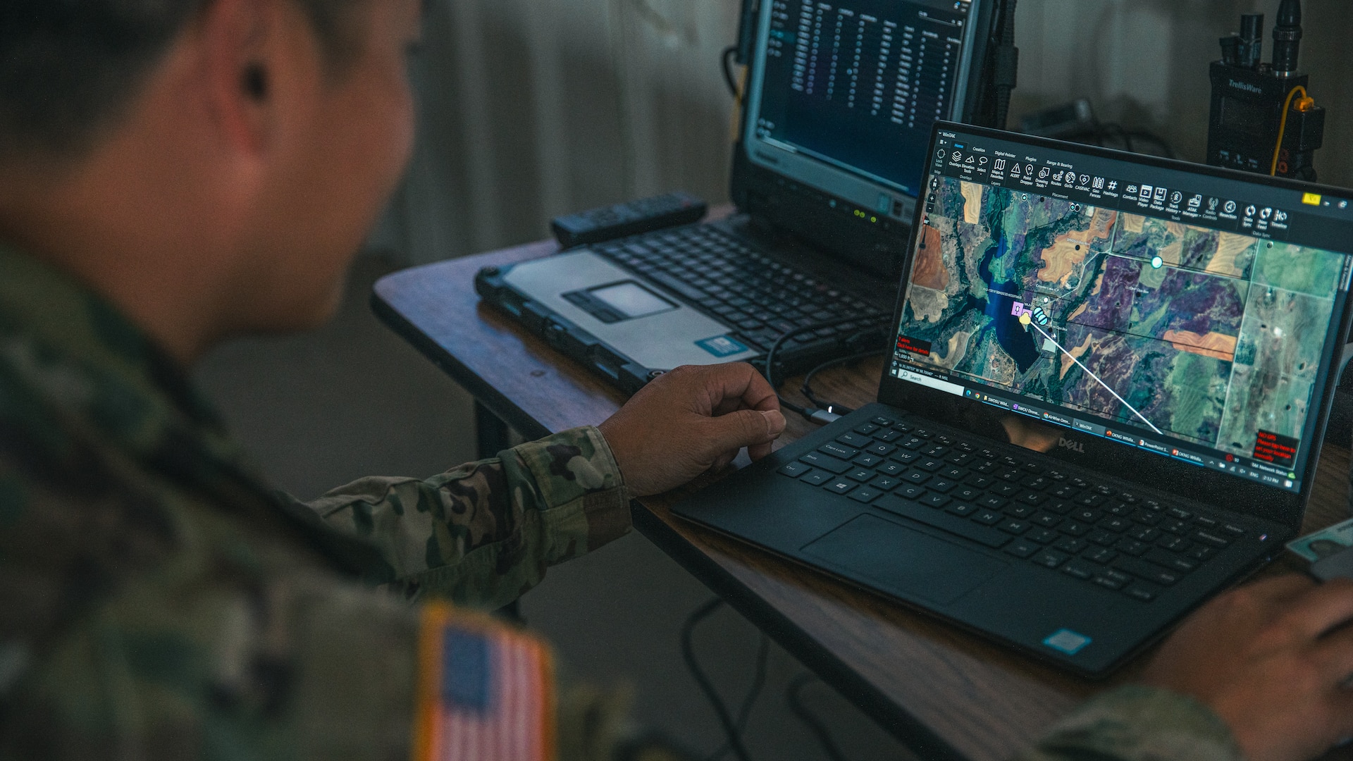 Maj. Lam Vo, an aviation officer assigned to the Oklahoma National Guard Joint Task Force, checks the common operating picture during a multi-agency wildland firefighting unmanned aerial systems integration exercise at Crowder Lake near Weatherford, Oklahoma, Sept. 25-26. The exercise brought the Oklahoma National Guard, state and local agencies and several private UAS companies together to develop a common operating picture, ensuring all public safety teams have a shared view of a multi-agency response to events like wildland firefighting. (Oklahoma National Guard photo by Staff Sgt. Reece Heck)