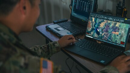 Maj. Lam Vo, an aviation officer assigned to the Oklahoma National Guard Joint Task Force, checks the common operating picture during a multi-agency wildland firefighting unmanned aerial systems integration exercise at Crowder Lake near Weatherford, Oklahoma, Sept. 25-26. The exercise brought the Oklahoma National Guard, state and local agencies and several private UAS companies together to develop a common operating picture, ensuring all public safety teams have a shared view of a multi-agency response to events like wildland firefighting. (Oklahoma National Guard photo by Staff Sgt. Reece Heck)