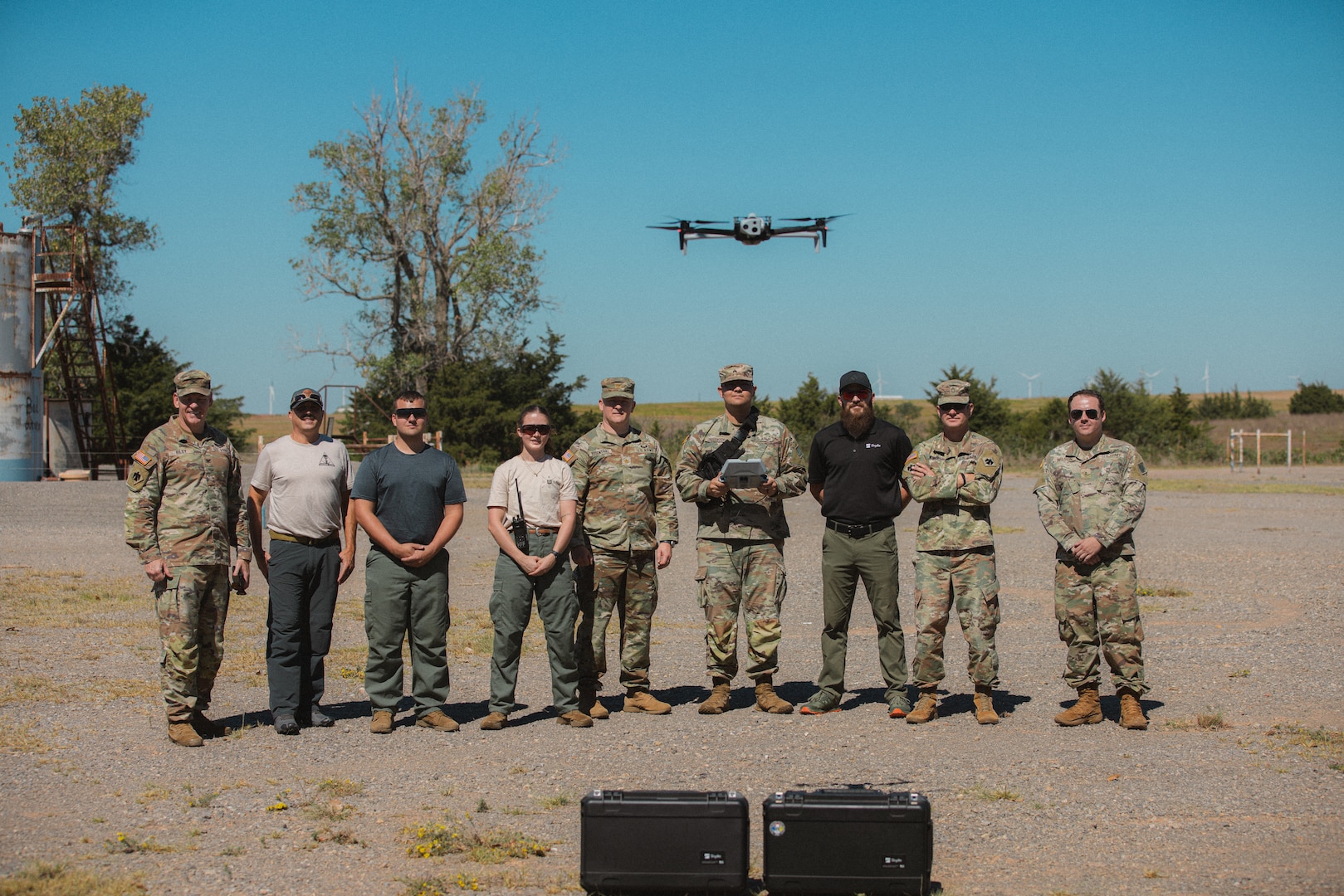 Members of the Oklahoma National Guard stand with local partners during a multi-agency wildland firefighting unmanned aerial systems integration exercise at Crowder Lake near Weatherford, Oklahoma, Sept. 25-26. The exercise brought the Oklahoma National Guard, state and local agencies and several private UAS organizations together to develop a common operating picture, ensuring all public safety teams have a shared view of a multi-agency response to events like wildland firefighting. (Oklahoma National Guard photo by Sgt. Haden Tolbert)