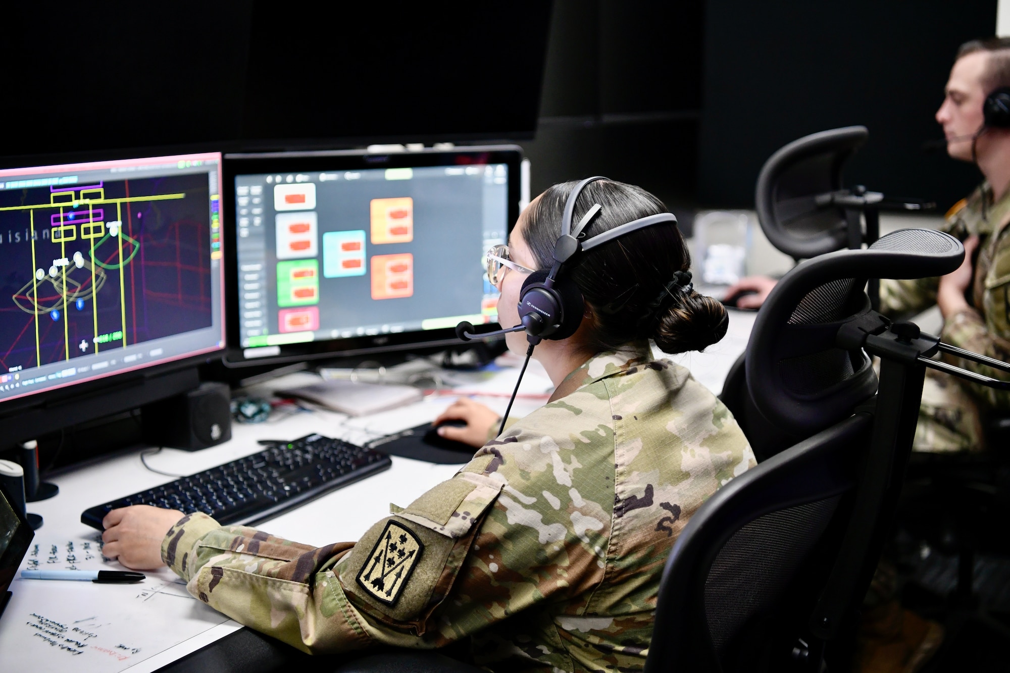 Soldier looking at a computer monitor