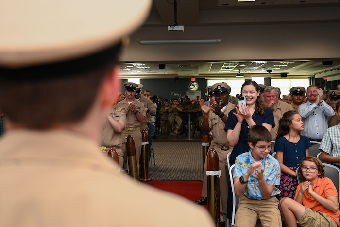 Friends and family of the new chief petty officers celebrate the ten new CPOs at the Fiscal Year 2025 Chief Petty Officer Pinning Ceremony at the Powell Event Center, Goodfellow Air Force Base, Texas, Sept. 27, 2024. Joint servicemembers across the 17th Training Wing attended the event to show support for the great career advancement that the chiefs received after being officially recognized as the newest chiefs of the mess. (U.S. Air Force photo by Airman 1st Class Evelyn J. D’Errico)
