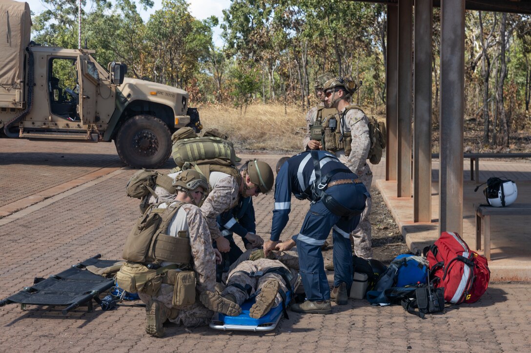 U.S. Marines and Sailors with Marine Rotational Force – Darwin 24.3 and a CareFlight medical specialist treat a simulated patient during a casualty evacuation exercise at Mount Bundey Training Area, NT, Australia, May 1, 2024. CareFlight treats and transports patients needing specialist care between medical facilities across Australia and internationally. Casualty evacuation rehearsals strengthen Sailors readiness and capabilities while in a deployed environment. MRF-D 24.3 is part of an annual six-month rotational deployment to enhance interoperability with the Australian Defence Force and Allies and partners and provide a forward-postured crisis response force in the Indo-Pacific. (U.S. Marine Corps photo by Sgt. Cristian Bestul)