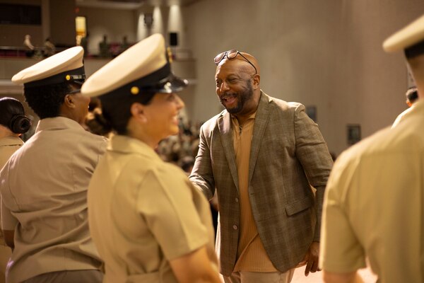 Retired Master Chief Clinton Garrett congratulates new chiefs pinned during the Chiefs Pinning Ceremony for NCR Navy Medicine in Memorial Hall at Walter Reed National Military Medical Center September 27, 2024. 16 Servicemembers received anchors at the ceremony. (DOD Photo by Christian Lilakos)