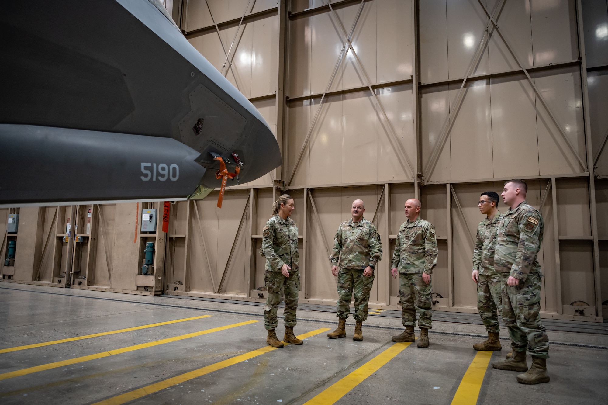 (Left to Right) Chief Master Sgt. Brandy Hales, Air Force Reserve Command Religious Affairs Senior Enlisted Leader, and Chaplain Col. James F. Danford, Air Force Reserve Command Chaplain, speak with Airmen from the 944th Fighter Wing during their visit to Luke Air Force Base, Ariz., Sept. 17, 2024. The visit focused on mentoring and sharing best practices between the 944th and 56th Fighter Wings’ chapel teams. (U.S. Air Force photo by Tech. Sgt. Tyler J. Bolken)