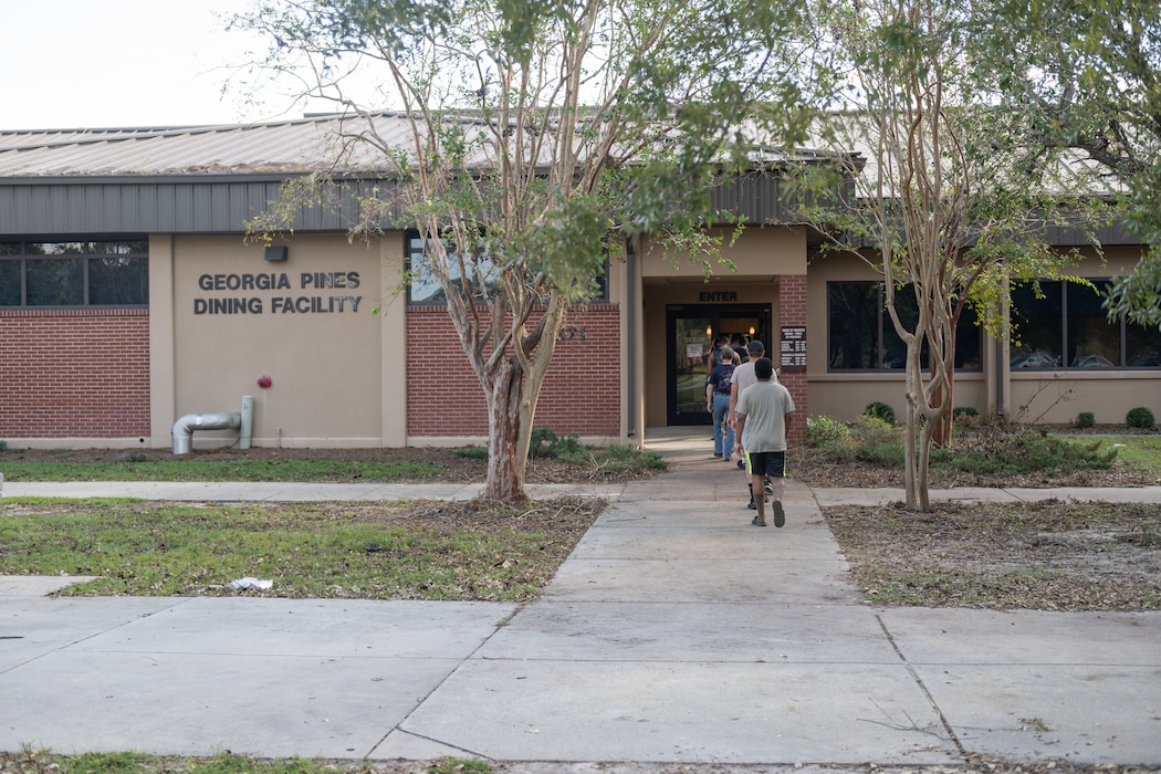 People walking into a building