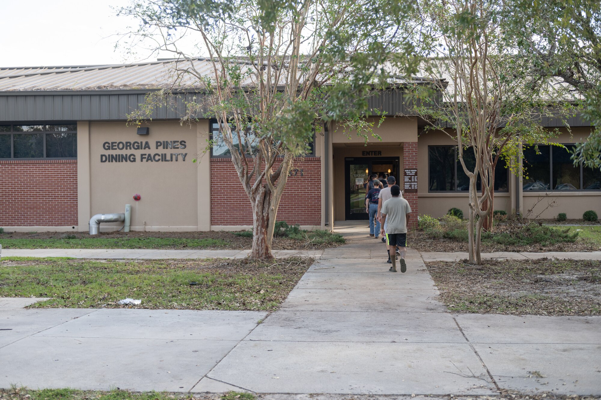 People walking into a building