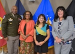 Retirees pose with their commander during a retirement ceremony September 26.
