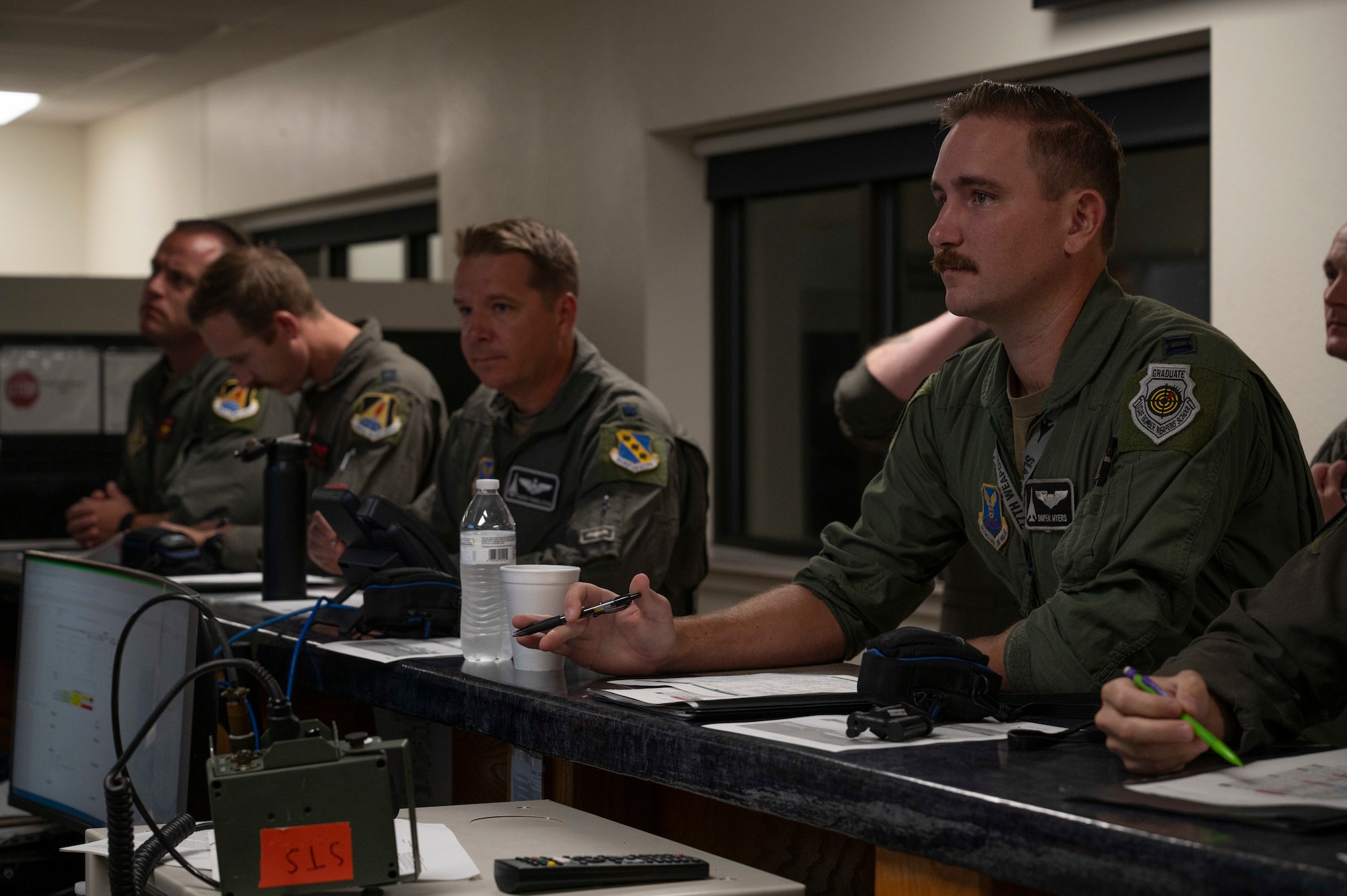 Aircrew members from the 9th Bomb Squadron and 489th Bomb Group attend a pre-flight briefing at Dyess Air Force Base, Texas, Sept. 30, 2024. Bomber missions contribute to joint force lethality and deter aggression in the Indo-Pacific by demonstrating USAF ability to operate anywhere in the world at any time in support of the National Defense Strategy. (U.S. Air Force photo by Airman 1st Class Emma Anderson)