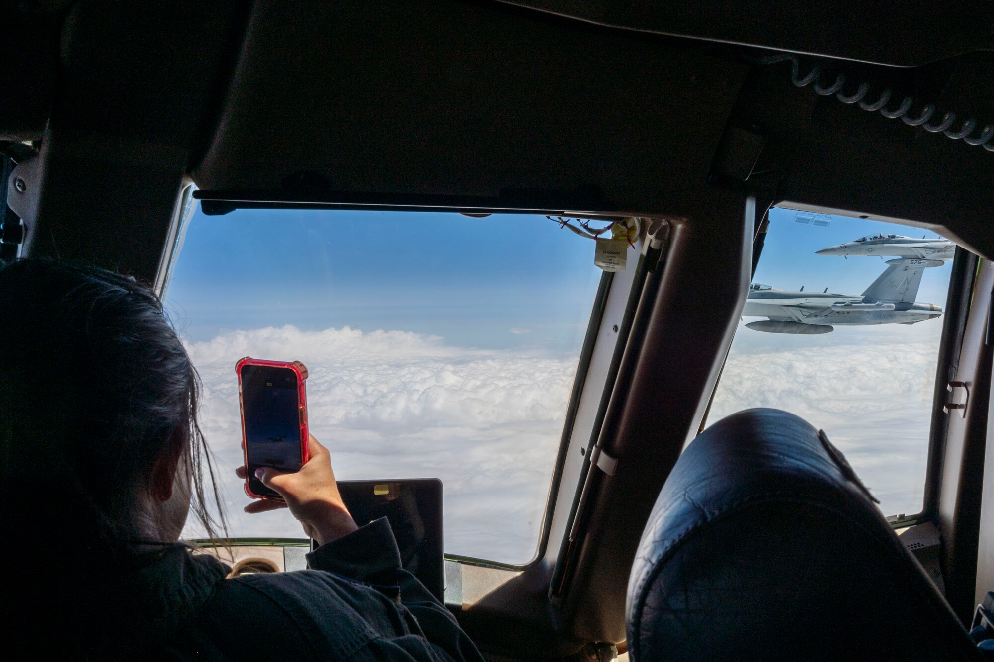 U.S. Air Force Capt. Elizabeth Brakefield captures a photo of U.S. Navy EA-18 Growlers from Naval Air Station Whidbey Island, Washington, during an aerial refueling mission May 28, 2024, over the midwestern United States. Elizabeth’s brother, U.S. Navy Lt. Lawson Brakefield, a Naval Flight Officer assigned to the "Vikings" of Electronic Attack Squadron (VAQ) 129, flew as a co-pilot aboard one of the EA-18’s. (U.S. Air Force photo by Airman 1st Class Gavin Hameed)