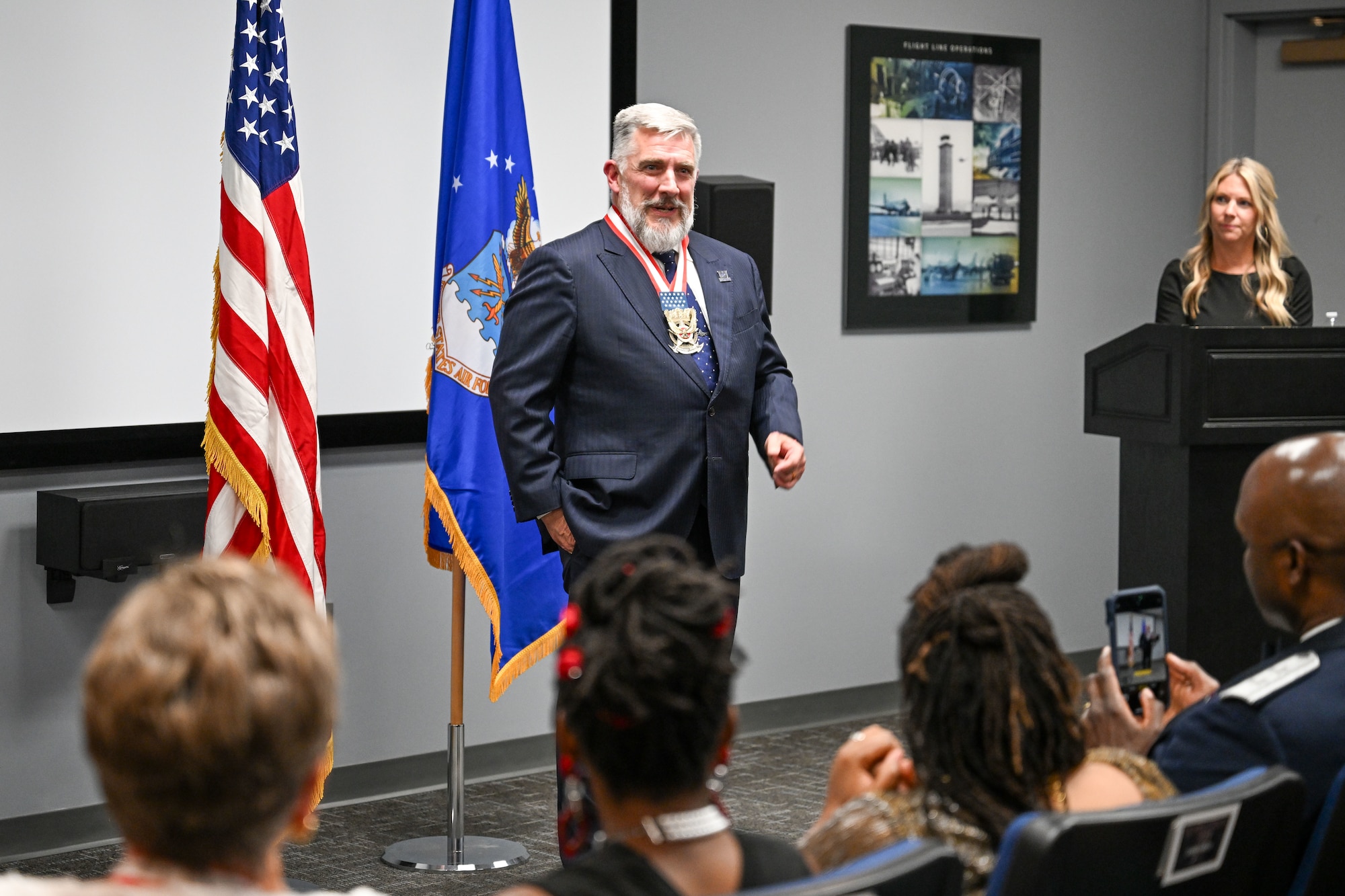 Mayor Shepherd stands addressing an audience.
