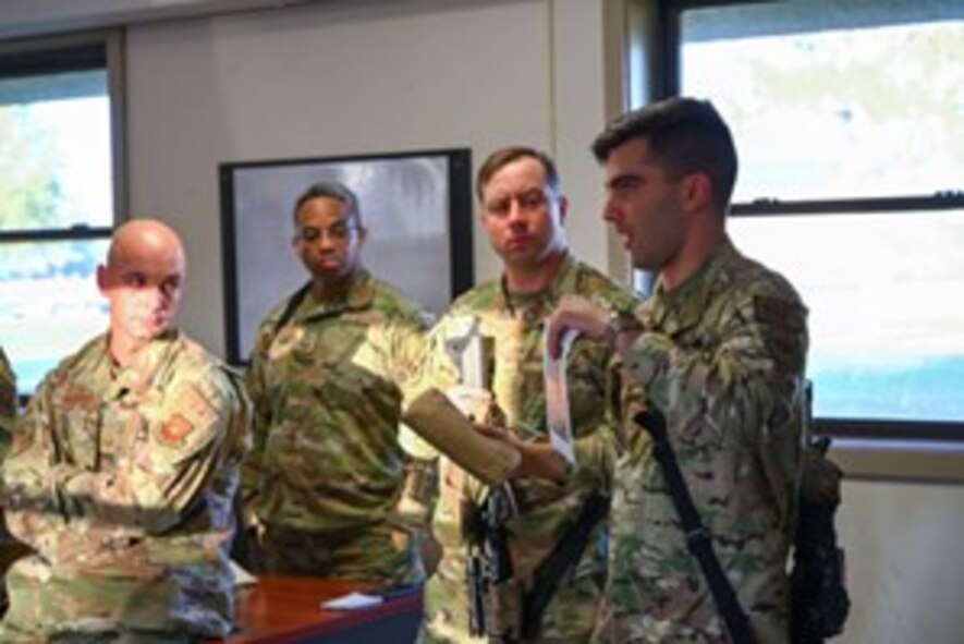 U.S. Air Force Capt. Nicolas Niazian, 891st Missile Security Forces Squadron (MSFS) operations officer, delivers a mission brief for Operation Cerberus at Camp Ripley, Minnesota, Sept. 22, 2024. Operation Cerberus was a readiness exercise designed to simulate a deployed environment and give an opportunity for Airmen of 891 MSFS to test their expeditionary skills.
