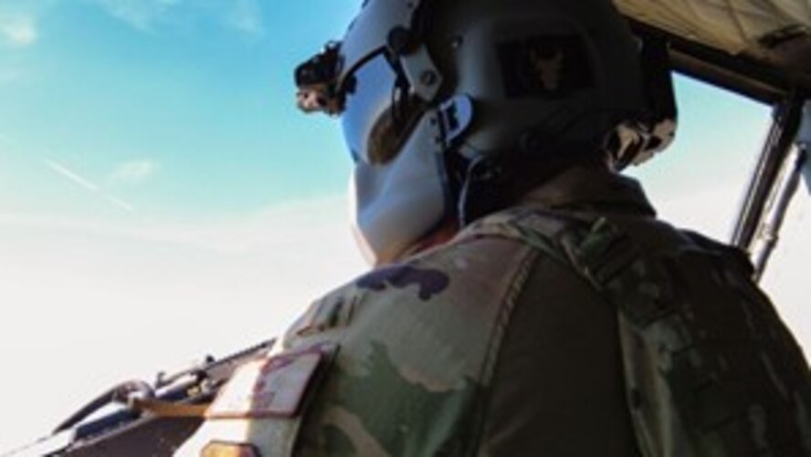 U.S. Air Force Staff Sgt. Jacob Sheets, 54th Helicopter Squadron UH-1N Iroquois flight engineer, awaits instruction while wielding a M-240 during Operation Cerberus at Camp Ripley, Minnesota, Sept. 23, 2024. Airmen from the 891st Missile Security Forces Squadron and 54 HS traveled to Camp Ripley to increase military readiness and improve team cohesion.