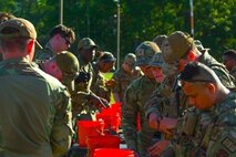 Airmen assigned to the 891st Missile Security Forces Squadron load their M-4 carbine rifle cartridges with ammo during Operation Cerberus at Camp Ripley, Minnesota, Sept. 26, 2024. The Airmen qualified with M-4 carbine rifles on a full-length weapons range, which tested their readiness capabilities.