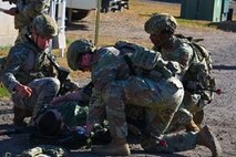 Airmen assigned to the 891st Missile Security Forces Squadron perform simulated tactical combat casualty care (TCCC) on their wingman during Operation Cerberus at Camp Ripley, Minnesota, Sept. 24, 2024. TCCC severely reduces the risk of hemorrhaging, which is the leading preventable cause of death in combat.