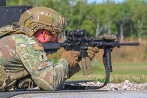 U.S. Air Force 1st Lt. Jakob Hauser, 891st Missile Security Forces Squadron flight commander, shoots an M-4 carbine rifle during Operation Cerberus at Camp Ripley, Minnesota, Sept. 24, 2024. Hauser tested his accuracy with an M-4 carbine rifle while shooting in different positions at the weapons range.