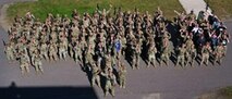 Airmen assigned to the 891st Missile Security Forces Squadron pose for a group photo at Camp Ripley, Minnesota, Sept. 26, 2024. Camp Ripley is a 53,000-acre training center with numerous ranges and facilities designed for military and civilian agencies to develop their skills.