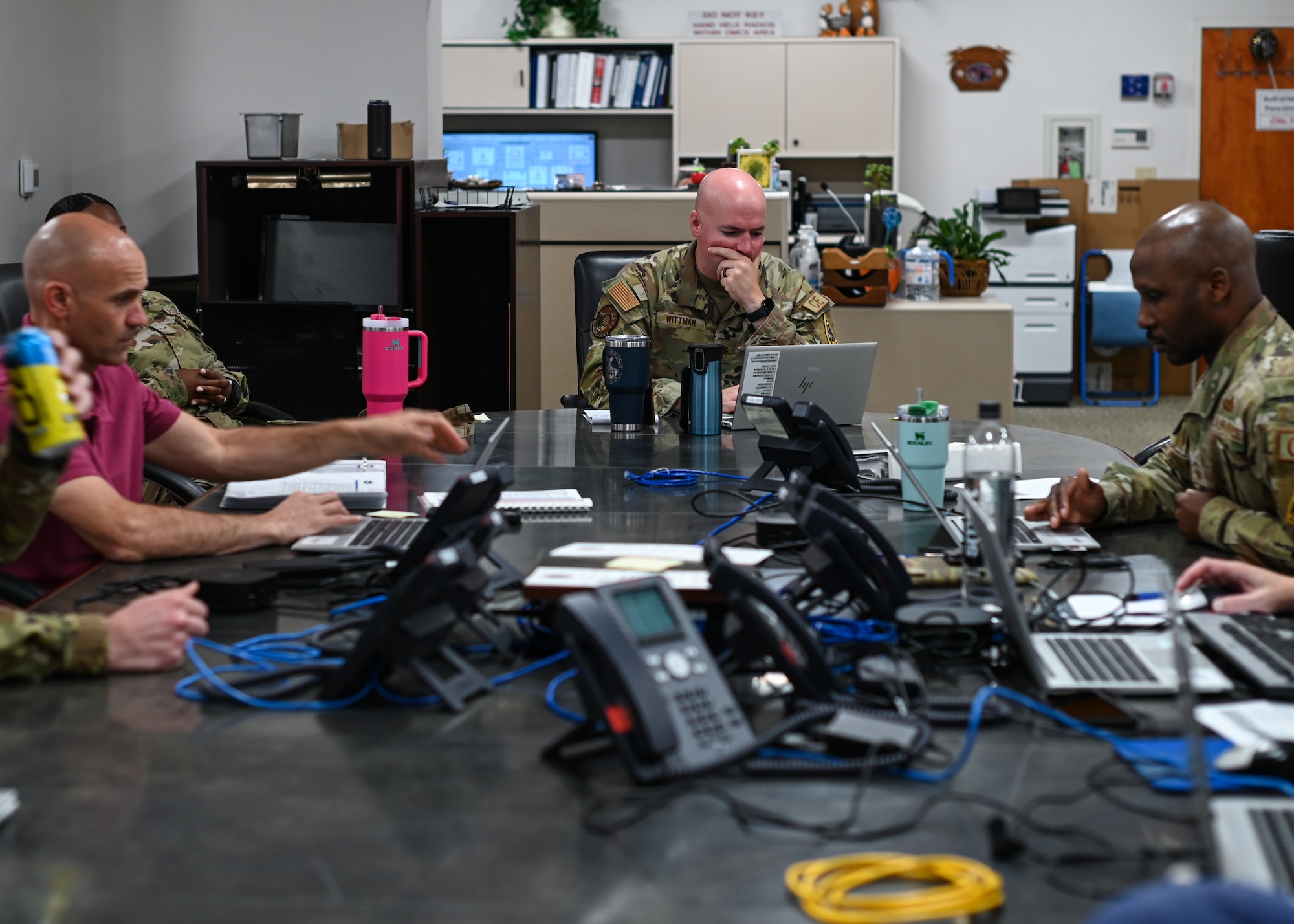 A  30th Civil Engineer Squadron operations flight commander, works with his colleagues to determine the appropriate level of response based on the severity of the simulated disaster during an emergency management exercise at Vandenberg Space Force Base.