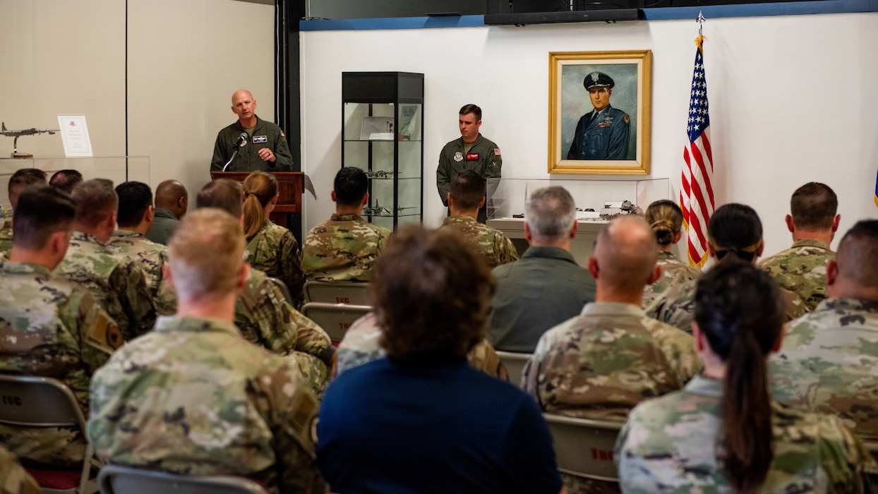 Base commander deliver remarks during ceremony