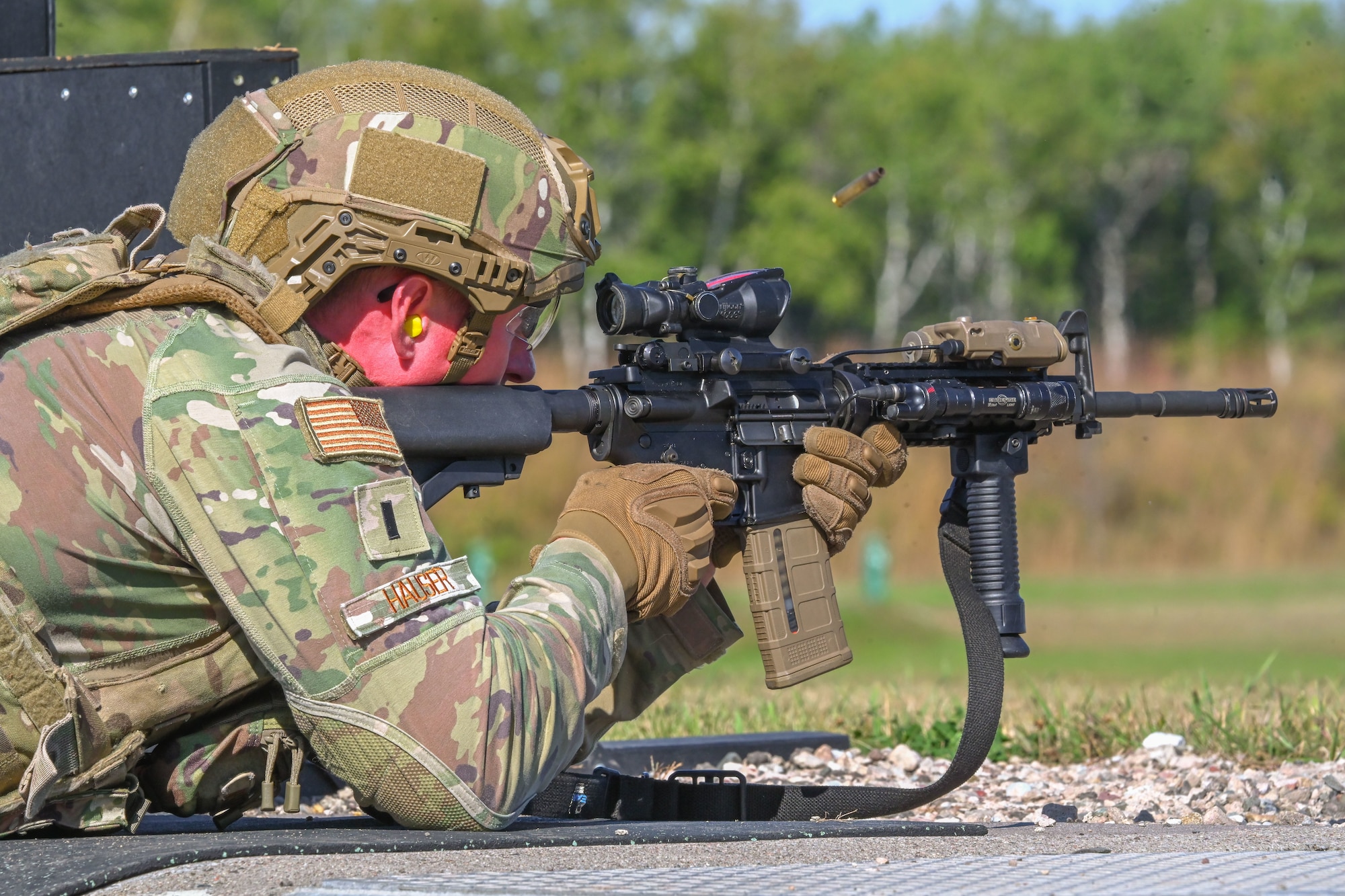 U.S. Air Force 1st Lt. Jakob Hauser, 891st Missile Security Forces Squadron flight commander, shoots an M-4 carbine rifle during Operation Cerberus at Camp Ripley, Minnesota, Sept. 24, 2024. Hauser tested his accuracy with an M-4 carbine rifle while shooting in different positions at the weapons range.