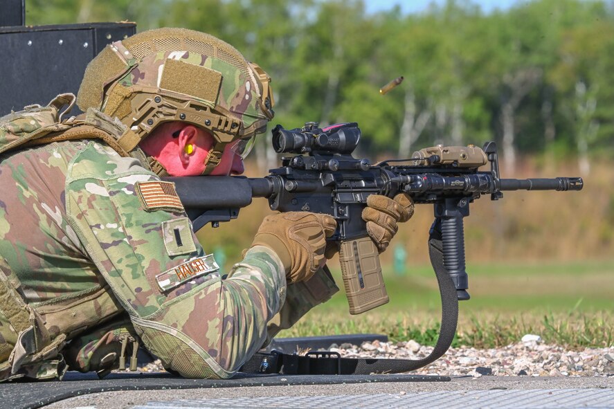 U.S. Air Force 1st Lt. Jakob Hauser, 891st Missile Security Forces Squadron flight commander, shoots an M-4 carbine rifle during Operation Cerberus at Camp Ripley, Minnesota, Sept. 24, 2024. Hauser tested his accuracy with an M-4 carbine rifle while shooting in different positions at the weapons range.