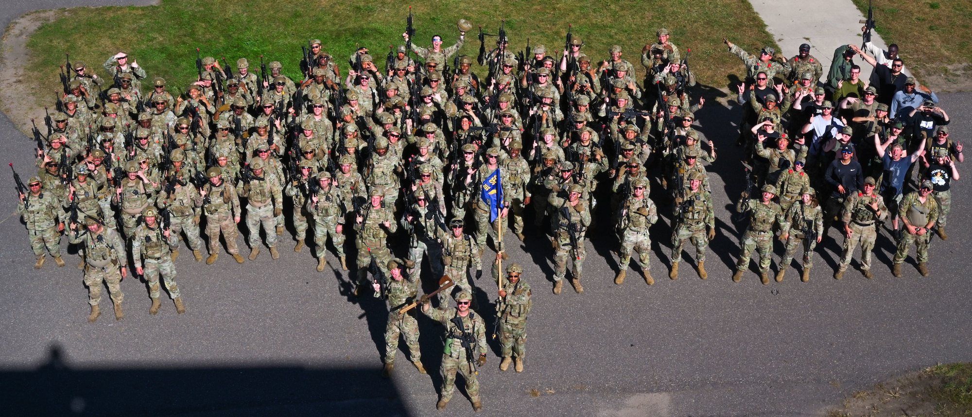 Airmen assigned to the 891st Missile Security Forces Squadron pose for a group photo at Camp Ripley, Minnesota, Sept. 26, 2024. Camp Ripley is a 53,000-acre training center with numerous ranges and facilities designed for military and civilian agencies to develop their skills.