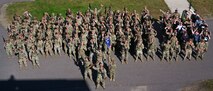 Airmen assigned to the 891st Missile Security Forces Squadron pose for a group photo at Camp Ripley, Minnesota, Sept. 26, 2024. Camp Ripley is a 53,000-acre training center with numerous ranges and facilities designed for military and civilian agencies to develop their skills.