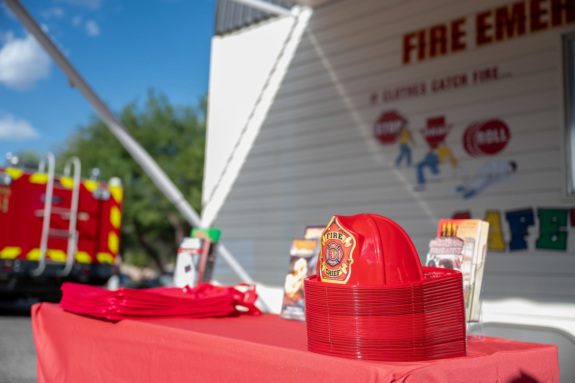 Fire protection themed items are on display during the National Night Out event at Davis-Monthan Air Force Base, Arizona, Oct. 1, 2024. National Night Out was an annual community-building campaign designed to connect local law enforcement with their community and promote neighborhood camaraderie. (U.S. Air Force photo by Airman 1st Class Jasmyne Bridgers-Matos)