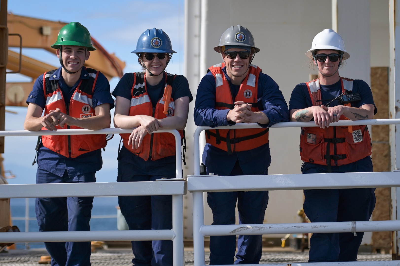 Crewmembers aboard U.S. Coast Guard Cutter Healy (WAGB 20) pose for a photo as the cutter prepares to depart Base Seattle, Oct. 1, 2024. This scheduled deployment will bring the cutter to the Bering, Chukchi, and Beaufort Seas for a second time this year. (U.S. Coast Guard photo by Petty Officer 1st Class Steve Strohmaier)