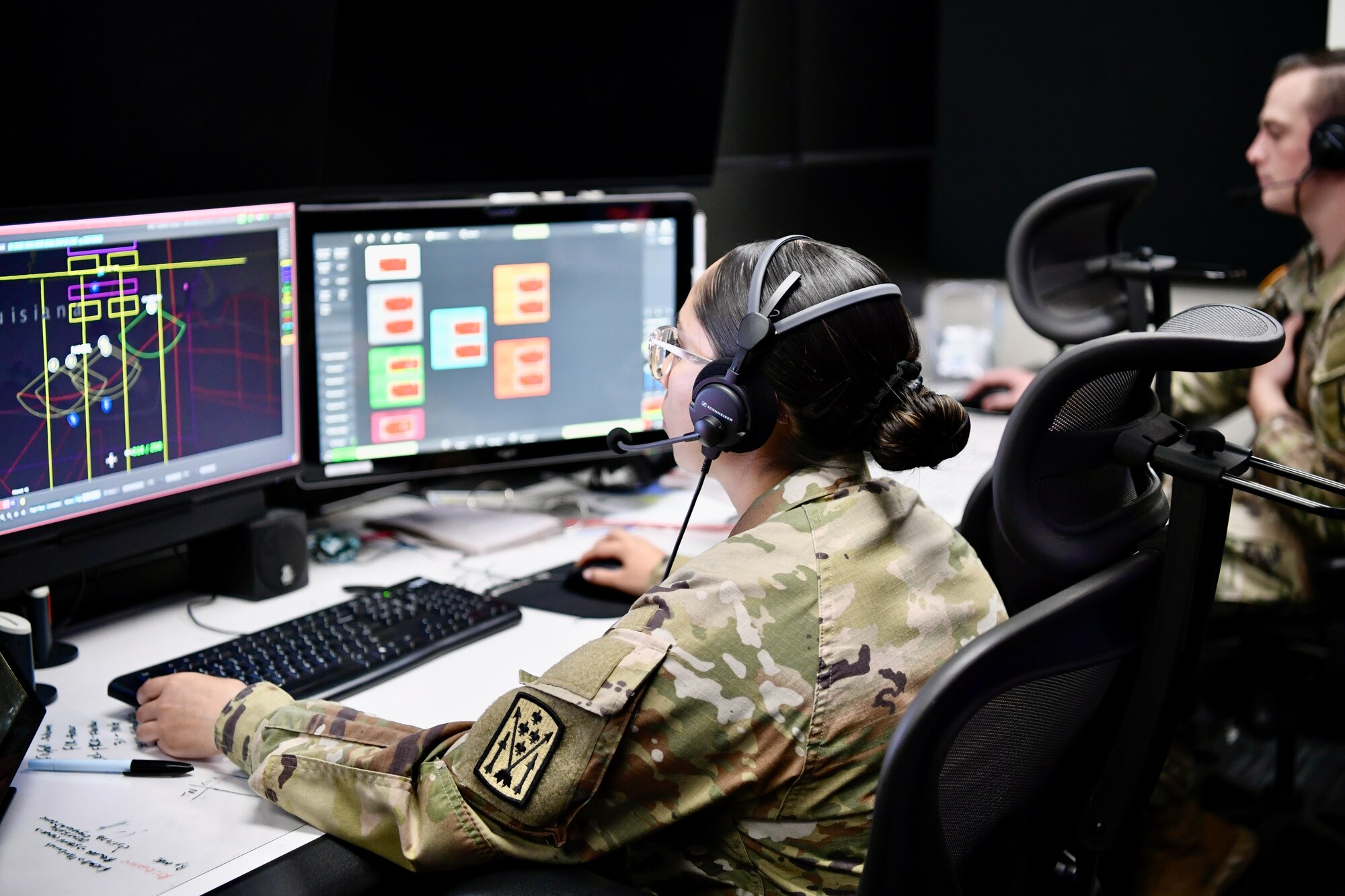 Soldier looking at a computer monitor
