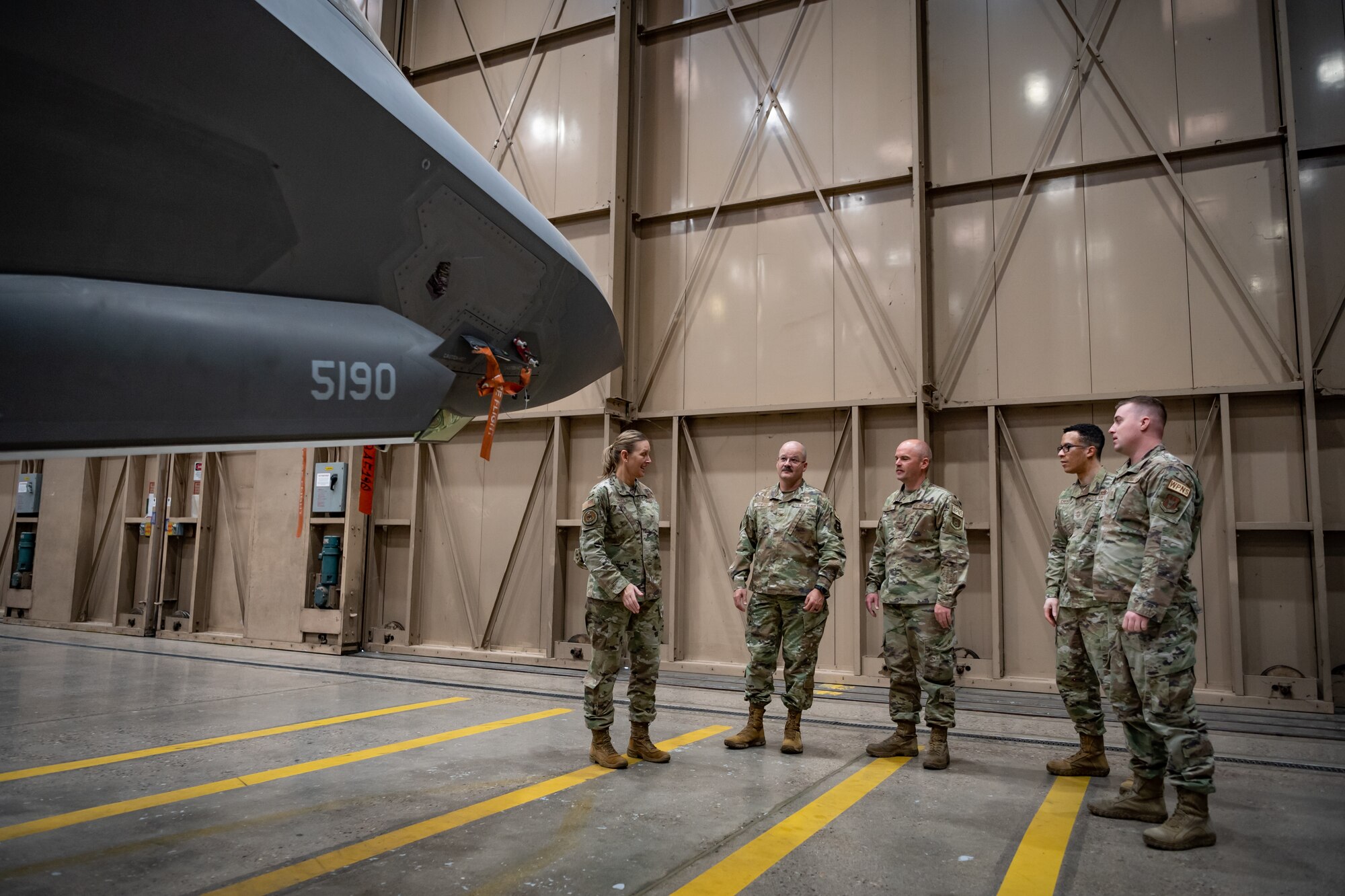 (Left to Right) Chief Master Sgt. Brandy Hales, Air Force Reserve Command Religious Affairs Senior Enlisted Leader, and Chaplain Col. James F. Danford, Air Force Reserve Command Chaplain, speak with Airmen from the 944th Fighter Wing during their visit to Luke Air Force Base, Ariz., Sept. 17, 2024. The visit focused on mentoring and sharing best practices between the 944th and 56th Fighter Wings’ chapel teams. (U.S. Air Force photo by Tech. Sgt. Tyler J. Bolken)