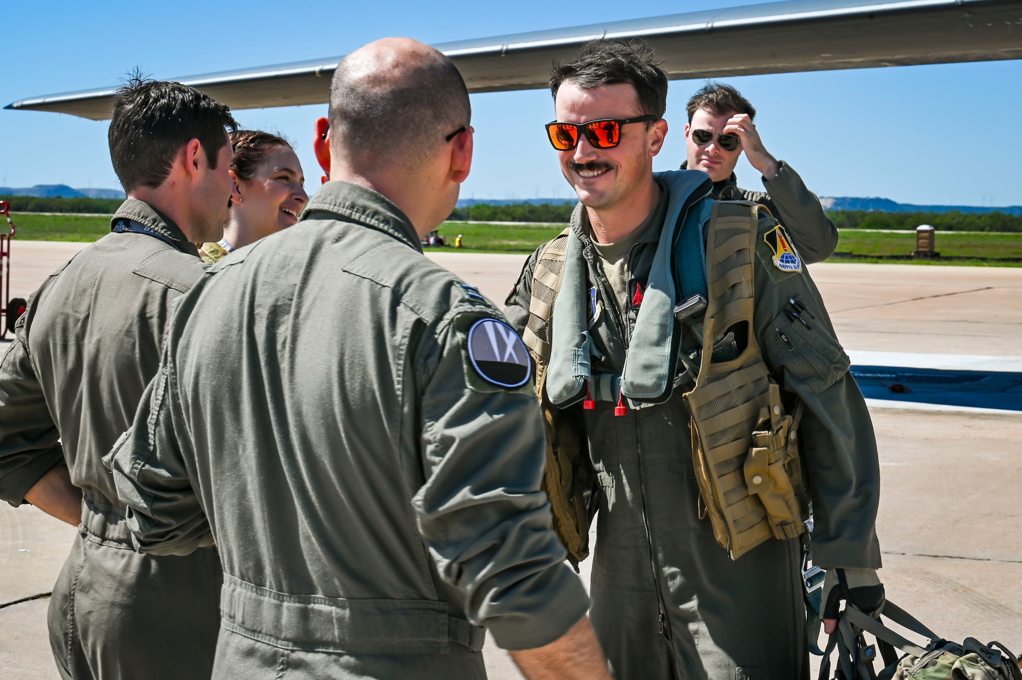 Members of the 9th Bomb Squadron greet 1st Lt. Lane Musgrave, 345th Bomb Squadron B-1B Lancer weapons system officer, at Dyess Air Force Base, Texas, after returning from a CONUS to CONUS mission in support of U.S. Indo-Pacific Command Oct. 1, 2024. Bomber missions contribute to joint force lethality and deter aggression in the Indo-Pacific by demonstrating USAF ability to operate anywhere in the world at any time in support of the National Defense Strategy. (U.S. Air Force photo by Staff Sgt. Matthew Angulo)