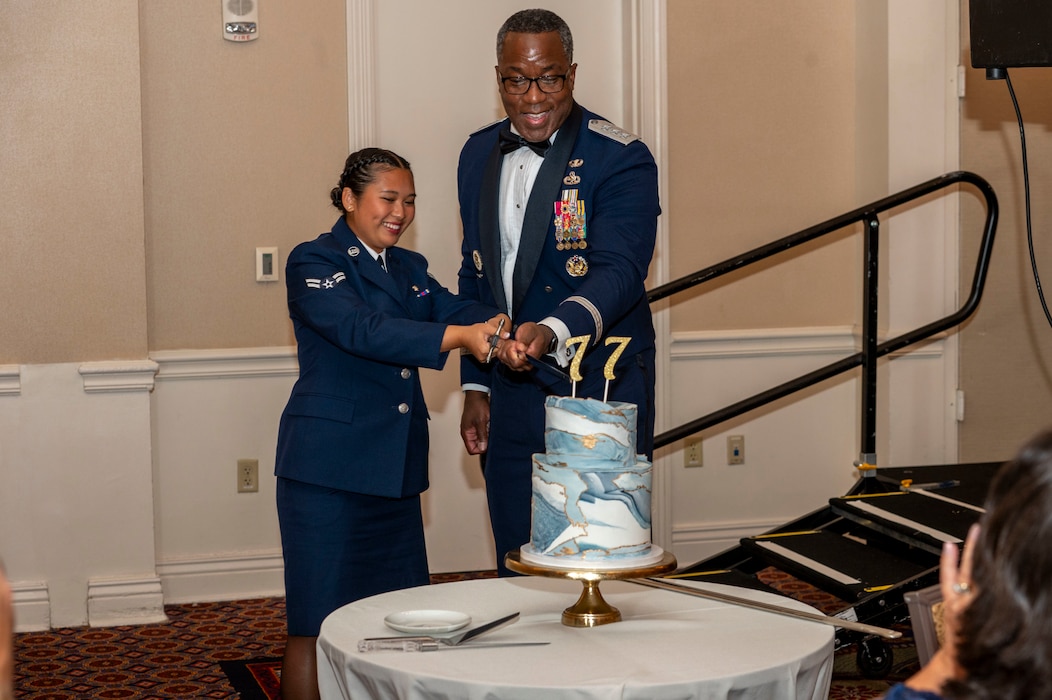 man and women cut a cake