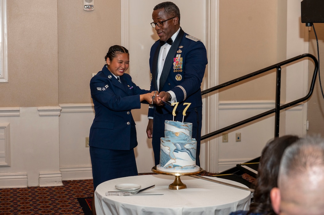 man and women cut a cake