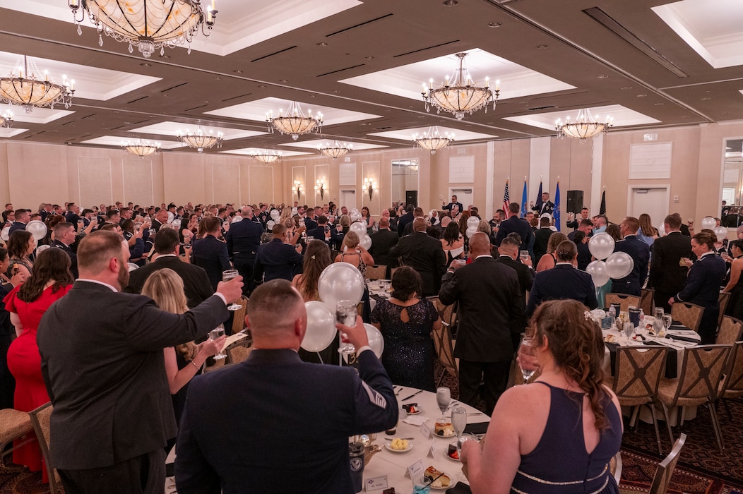 people raise their glasses at a ball