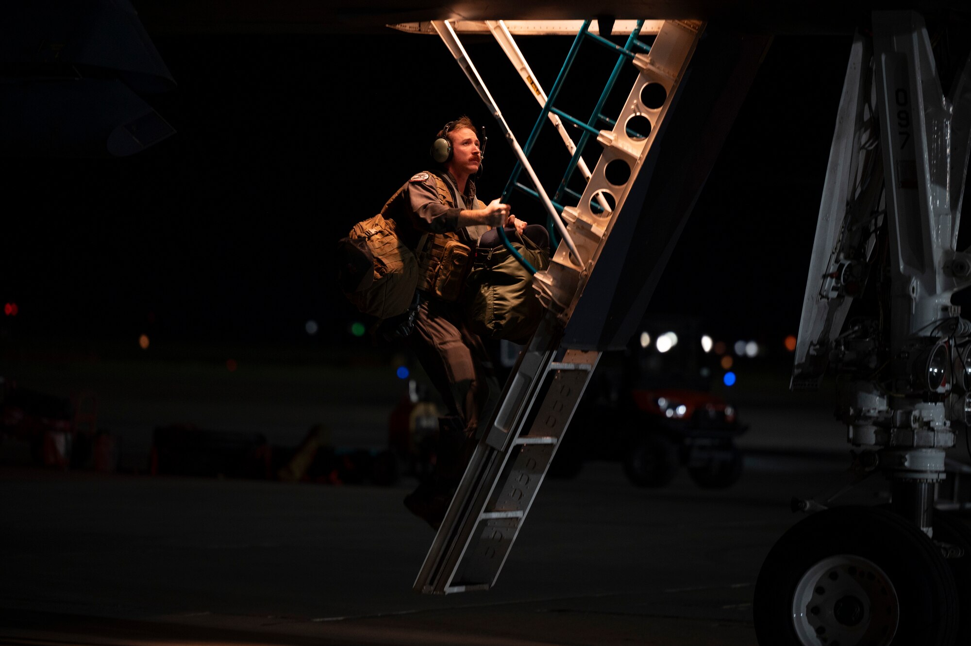 A 489th Bomb Group aircrew member boards a B-1B Lancer on the flightline at Dyess Air Force Base, Texas, Sept. 30, 2024. Bomber missions support national security objectives through the speed, flexibility, and readiness of our strategic bombers. (U.S. Air Force photo by Airman 1st Class Emma Anderson)