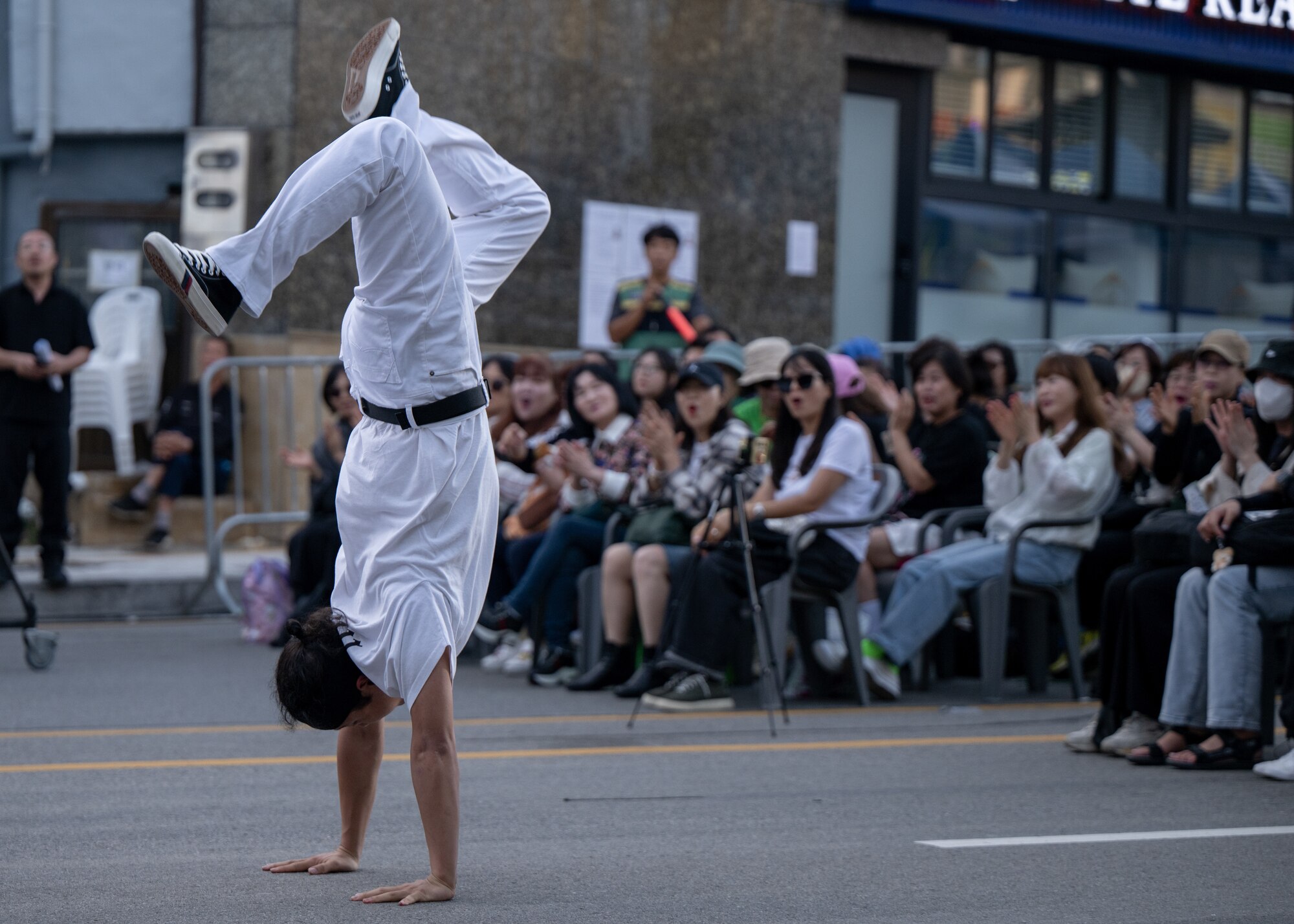 A member of a Republic of Korea street dance team, “Massa Crew”, performs for attendees at the 21st annual Republic of Korea and U.S. Cultural Festival, held outside of Osan Air Base, ROK, Sept. 28, 2024. The festival, hosted by the local South Korean communities, featured performances from both communities to reinforce positive relationships between South Korea and the U.S. (U.S. Air Force photo by Maj. Kippun Sumner)