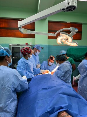 Cmdr. Louis Lewandowski, an orthopedic trauma surgeon assigned to Expeditionary Medical Facility (EMF) Kilo, operates with the Honduran orthopedic resident team on a trauma patient in the operating room at Hospital Escuela, Tegucigalpa, Honduras, Sep. 17, 2024. In collaboration with joint forces and the partner nation, EMF Kilo conducted its first orthopedic surgical mission alongside Hospital Escuela medical staff treating and performing surgical procedures on patients with oncologic or orthopedic traumatic injuries. (U.S. Navy photo by Lt. Cmdr. Sheree Blackwell)