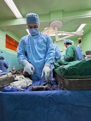 Hospital Corpsman Second Class Brandon Cassidy, a surgical technologist assigned to Expeditionary Medical Facility (EMF) Kilo, prepares his surgical field prior to surgery in the operating room of Hospital Escuela, Tegucigalpa, Honduras, Sep. 18, 2024. In collaboration with joint forces and the partner nation, EMF Kilo conducted its first orthopedic surgical mission alongside Hospital Escuela medical staff treating and performing surgical procedures on patients with oncologic or orthopedic traumatic injuries. (U.S. Navy photo by Lt. Cmdr. Sheree Blackwell)