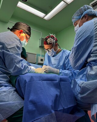 Cmdr. Louis Lewandowski (right back), an orthopedic trauma surgeon, and Hospital Corpsman Second Class Brandon Cassidy (right), a surgical technologist assigned to Expeditionary Medical Facility (EMF) Kilo, work alongside a Honduran chief orthopedic resident (left) to perform surgery on a patient’s wrist at Hospital Escuela, Tegucigalpa, Honduras, Sep. 20, 2024. In collaboration with joint forces and the partner nation, EMF Kilo conducted its first orthopedic surgical mission alongside Hospital Escuela medical staff treating and performing surgical procedures on patients with oncologic or orthopedic traumatic injuries. (U.S. Navy photo by Lt. Cmdr. Sheree Blackwell)