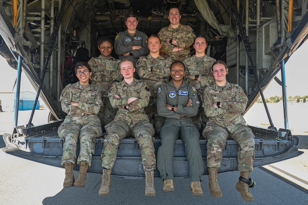 Airmen assigned to the 62nd Airlift Squadron pose for a group photo at a Girls in Aviation event in Oakland, California, Sept. 28, 2024.Through interactive workshops and engaging presentations, participants discovered the diverse career paths available to them, ranging from piloting and engineering to air traffic control and aviation management.