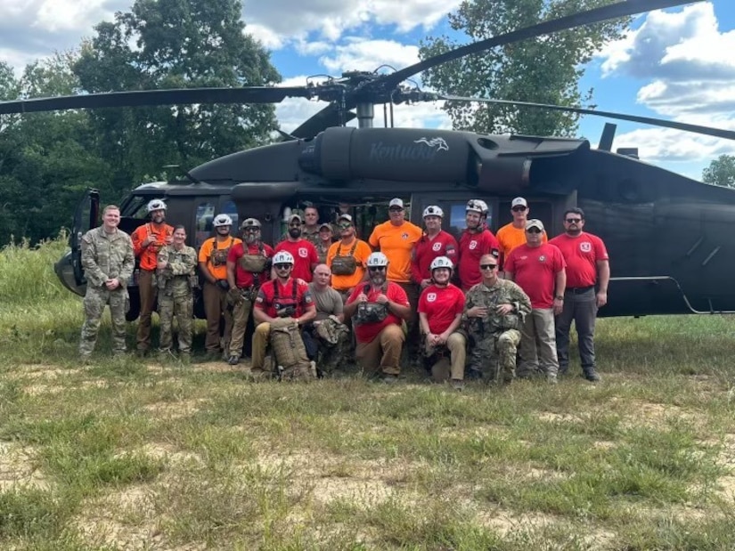 Soldiers with the 63rd Theater Aviation Brigade pose for a photo with members of Wolfe County search and rescue team and Red Star Wilderness emergency medical services at the Disney Training Center in Artemus, Kentucky on Sept. 14, 2024.