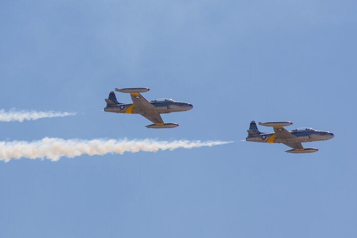 Two T-33 Shooting Stars perform aerial maneuvers during the 2024 Marine Corps Air Station Miramar Airshow at MCAS Miramar in San Diego, Sept. 28, 2024. The MCAS Miramar Airshow provides a unique flightline experience with static displays and daytime shows that feature military demonstration teams, civilian acrobatic teams, aerial solo acts, vintage aircraft and warbirds. (U.S. Marine Corps photo by Cpl. Bruin Largent)